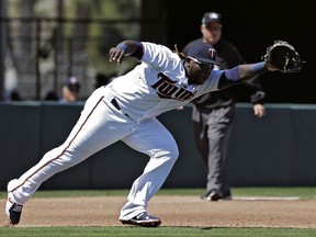 Minnesota Twins third baseman Miguel Sano can't get to a ground ball during a spring training game Wednesday, March 14, 2018, in Fort Myers, Fla. (AP Photo/Chris O'Meara)