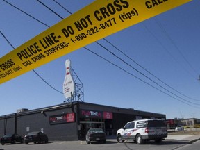 Toronto Police Services investigate after two people were gunned down at a Toronto bowling alley. (STAN BEHAL/POSTMEDIA NETWORK)