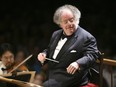 In this July 7, 2006 file photo, Boston Symphony Orchestra music director James Levine conducts the symphony on its opening night performance at Tanglewood in Lenox, Mass.