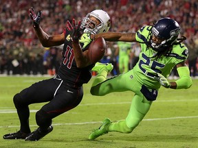 Richard Sherman of the Seattle Seahawks breaks up a pass intended for Larry Fitzgerald of the Arizona Cardinals at University of Phoenix Stadium on November 9, 2017 in Glendale, Arizona. (Christian Petersen/Getty Images)