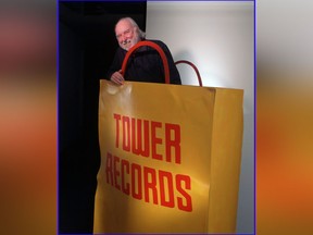 In this 1997 file photo, Russell Solomon, founder of Tower Records, is photographed inside a sculpture at the Tower Records headquarters in Sacramento, Calif. (Michael A. Jones/The Sacramento Bee via AP, File)