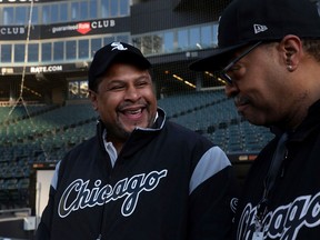 Nevest Coleman, left, smiles as fellow grounds crew and friend Harry Smith Jr. shows off some of the newer features of Guaranteed Rate Field in Chicago on March 26, 2018