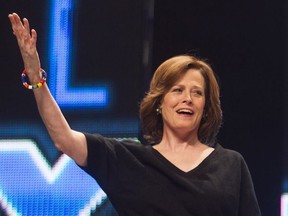 Aliens star Sigourney Weaver greets the crowd during the Aliens EXPOsed panel in the Calgary Comic and Entertainment Expo at the Corral in Calgary, Alta., on Saturday, April 26, 2014.