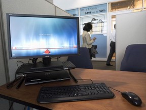 A Service Canada processing station is set up at Pearson International Airport in Toronto, Ont. on Tuesday, December 8, 2015.