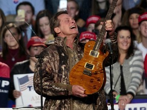 In this Nov. 7, 2016 file photo, musician Ted Nugent performs before Republican presidential candidate Donald Trump comes on stage for his campaign rally before the general election, in the Grand Gallery at DeVos Place in Grand Rapids, Mich.  (Joel Bissell/The Grand Rapids Press via AP, File)