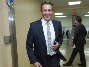 In this Feb. 9, 2018, file photo, Sen. Jeff Flake, R-Ariz., walks to the senate chamber for early morning votes at Capitol Hill in Washington.