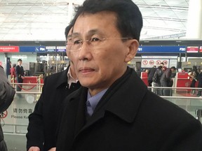 Choe Kang Il, a senior North Korean diplomat handling North American affairs, walks at Beijing Capital International Airport in Beijing Sunday, March 18, 2018. South Korea's Yonhap news agency is reporting that Choe is heading to Finland for "semiofficial" talks with the U.S. and South Korea. (Kyodo News via AP)