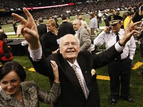 This Dec. 19, 2009, file photo shows New Orleans Saints owner Tom Benson walking on the field before a game against the Dallas Cowboys in New Orleans. (AP Photo/Dave Martin, File)