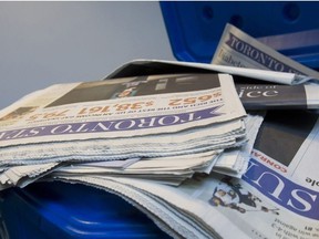 In this file photo, Toronto Star newspapers sit in a recycling bin.