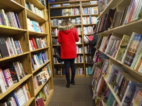 In this Feb. 17, 2018 photo, shoppers browse among the narrow rows of books at The Book Loft of German Village in Columbus, Ohio. The 40-year-old bookstore features 32 rooms of books.