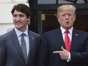 Prime Minister Justin Trudeau is greeted by U.S. President Donald Trump as he arrives at the White House in Washington, D.C., on Oct. 11, 2017. THE CANADIAN PRESS/Sean Kilpatrick