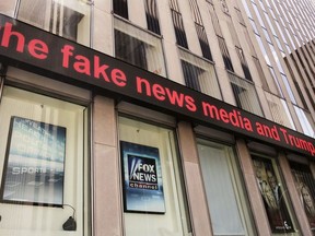 News headlines scroll above the Fox News studios in the News Corporation headquarters building in New York, Tuesday, Aug. 1, 2017.