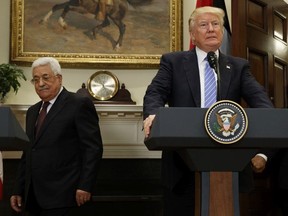 In this May 3, 2017 file photo, President Donald Trump and Palestinian Authority President Mahmoud Abbas arrive in the Roosevelt Room of the White House in Washington.