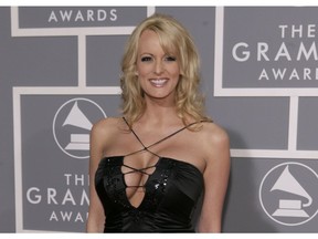 In this Feb. 11, 2007, file photo, adult film actress Stormy Daniels arrives for the 49th Annual Grammy Awards in Los Angeles. Stormy Daniels, whose real name is Stephanie Clifford, is suing President Donald Trump and wants a California judge to invalidate a nondisclosure agreement she signed days before the 2016 presidential election.