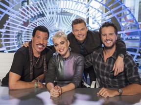 This image released by ABC shows, from left, Lionel Richie, Katy Perry, Ryan Seacrest and Luke Bryan on the set of "American Idol" in New York. (Eric Liebowitz/ABC via AP)