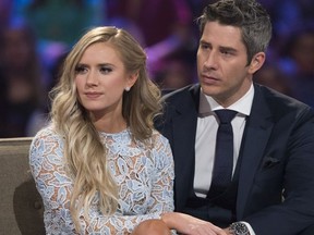 This image released by ABC shows Lauren Burnham, left, and Arie Luyendyk Jr. on "The Bachelor: After the Final Rose." Luyendyk  says he's willing to take the heat for dumping Becca Kufrin to find true love with runner-up Lauren Burnham. His decision to break up with Kufrin during Monday's season finale after they'd become engaged prompted such descriptive headlines as "horror," "brutal" and "gut-wrenching," (Paul Hebert/ABC via AP) ORG XMIT: NYET311