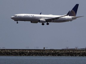 In this July 11, 2017, file photo, a United Airlines plane lands at San Francisco International Airport.