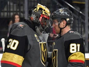 Vegas Golden Knights goalie Malcolm Subban and forward Jonathan Marchessault celebrate a win over the Vancouver Canucks on March 20.