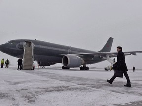 In this file photo, Canadian Prime Minister Justin Trudeau walks across a snow covered tarmac towards his plane as he departs Ottawa for Davos, Switzerland for the annual World Economic Forum on Monday, January 22, 2018.