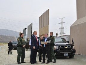 U.S. President Donald Trump inspects border wall prototypes in San Diego, California on March 13, 2018. (MANDEL NGAN/AFP/Getty Images)