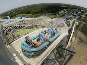 In this July 9, 2014, file photo, riders go down the water slide called "Verruckt" at Schlitterbahn Waterpark in Kansas City, Kan.