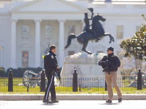 Law enforcement officers at Lafayette Park across from the White House in Washington, close the area to pedestrian traffic, Saturday, March 3, 2018. (AP Photo/Pablo Martinez Monsivais