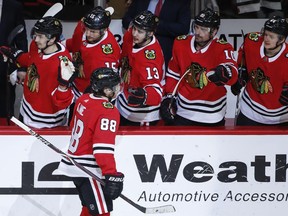Blackhawks right wing Patrick Kane (88) celebrates with teammates after scoring against the Jets during the first period Thursday, March 29, 2018, in Chicago.