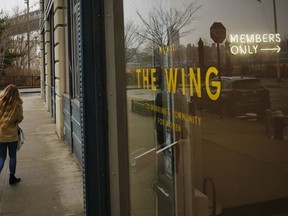 The lobby entrance for The Wing, a private club founded as work space and networking hub exclusively for women, display a lighted "Members Only" sign, Thursday March 29, 2018, in the Dumbo section of Brooklyn borough in New York.