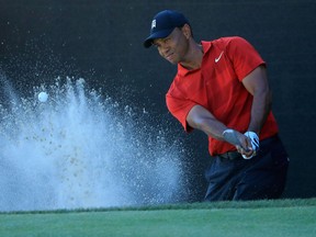 Tiger Woods plays a shot from a bunker on the 17th hole during the final round at the Arnold Palmer Invitational Presented By MasterCard at Bay Hill Club and Lodge on March 18, 2018
