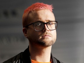 Canadian data analytics expert and whistleblower Christopher Wylie poses for photographs outside a press conference in London on March 26, 2018. (TOLGA AKMEN/AFP/Getty Images)