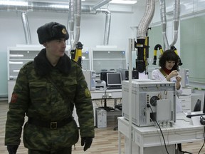 In this Friday, Nov. 26, 2010 file photo, a Russian officer walks through a laboratory at Russia's plant for the destruction of chemical weapons in Pochep, 250 miles southwest of Moscow, Russia. (AP Photo/Misha Japaridze, file)