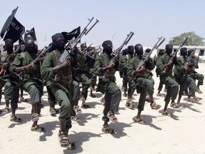 In this Thursday, Feb. 17, 2011 file photo, hundreds of newly trained al-Shabab fighters perform military exercises in the Lafofe area some 18 km south of Mogadishu, in Somalia.