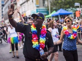 In this file photo, Toronto police chief Mark Saunders marches during the annual Pride parade in Toronto, in a July 3, 2016.