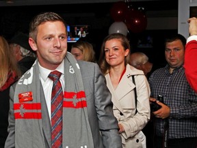 Liberal Francis Drouin and his wife, Kate, arrive at Gab's Sports Bar in Clarence-Rockland after winning the Glengarry-Prescott-Russell seat on Oct. 19, 2015.