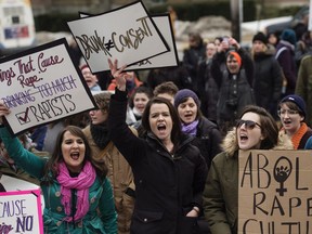 Demonstrators protest Judge Gregory Lenehan's decision to acquit a Halifax taxi driver charged with sexual assault during a rally in Halifax on Tuesday, March 7, 2017.