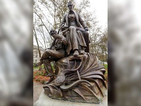 The bronze sculpture of Pittsburgh-born songwriter Stephen Foster by Giuseppe Moretti, stands near the entrance of the Carnegie Music Hall at Schenley Plaza in the Oakland section of Pittsburgh, Thursday, Oct. 26, 2017.