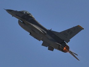 In this file photo, a U.S. Air Force F-16 Fighting Falcon Raptor performs during the Australian International Airshow in Melbourne on March 1, 2013.
