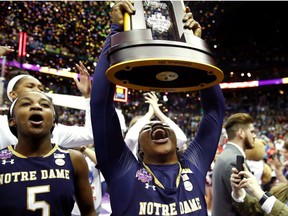 Arike Ogunbowale #24 of the Notre Dame Fighting Irish hoist the NCAA championship trophy after scoring the game winning basket to defeat the Mississippi State Lady Bulldogs in the championship game of the 2018 NCAA Women's Final Four at Nationwide Arena on April 1, 2018 in Columbus, Ohio. The Notre Dame Fighting Irish defeated the Mississippi State Lady Bulldogs 61-58.