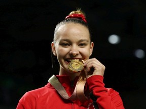 Gold medalist Shallon Olsen of Canada poses during the medal ceremony for the WomenÕs Vault Final during Gymnastics on day four of the Gold Coast 2018 Commonwealth Games at Coomera Indoor Sports Centre on April 8, 2018 on the Gold Coast, Australia.