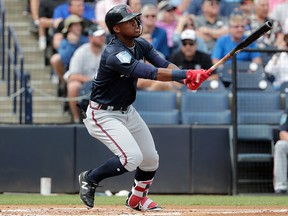 In this Friday, March 2, 2018, file photo, Atlanta Braves' Ronald Acuna watches after hitting a  home run during a spring exhibition game against the New York Yankees, in Tampa, Fla. (AP Photo/Lynne Sladky, File)
