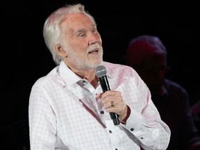 (FILES) In this file photo taken on March 18, 2017, Kenny Rogers performs live in concert on his 'Farewell Tour' during Rodeo Austin at the Travis County Expo Center in Austin, Texas.