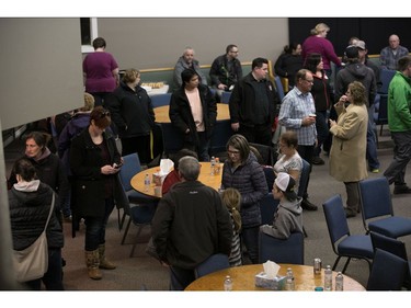 Families, friends and supporters of the Humboldt hockey team gathered in Nipawin's Apostolic Church as they wait for news of loved ones on April 6, 2018 after a bus carrying a junior ice hockey team collided with a semi-trailer truck between Tisdale and Nipawin, Saskatchewan province, killing 14 people. Hockey-mad Canada was in mourning on Saturday after a bus carrying a junior ice hockey team collided with a semi-trailer truck in Saskatchewan province, killing 14 people.In a country where love of the sport is almost a religion, the crash sparked an outpouring of grief among players and fans on social media, while national political leaders expressed their sympathies."We can now confirm 14 people have died as a result of this collision," the Royal Canadian Mounted Police said in a statement, which did not say how many of the victims were players or coaches of the Humboldt Broncos team.