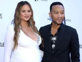 Chrissy Teigen (L) and musician John Legend attend The Daily Front Row's 4th Annual Fashion Los Angeles Awards at Beverly Hills Hotel on April 8, 2018 in Beverly Hills, California.