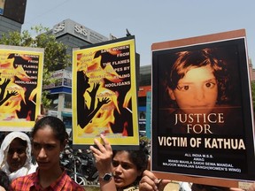 Indian activists and students protest over the rape of a child near Jammu and a rape case in Uttar Pradesh state, in Ahmedabad on April 13, 2018. SAM PANTHAKY/AFP/Getty Images