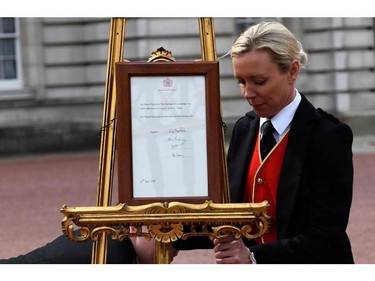 Palace staff position a Royal bulletin, announcing that Britain's Catherine, Duchess of Cambridge, the wife of Britain's Prince William, has given birth to a baby boy, on an easel on the forecourt of Buckingham Palace in London on April 23, 2018. Kate, the wife of Britain's Prince William, has given birth to a baby son, Kensington Palace announced Monday. "Her Royal Highness The Duchess of Cambridge was safely delivered of a son at 11:01 (1001 GMT)," the palace said in a statement. The baby boy weighs eight pounds and seven ounces (3.8 kilogrammes).