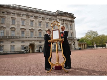 Palace staff position a Royal bulletin, announcing that Britain's Catherine, Duchess of Cambridge, the wife of Britain's Prince William, has given birth to a baby boy, on an easel on the forecourt of Buckingham Palace in London on April 23, 2018. Kate, the wife of Britain's Prince William, has given birth to a baby son, Kensington Palace announced Monday. "Her Royal Highness The Duchess of Cambridge was safely delivered of a son at 11:01 (1001 GMT)," the palace said in a statement. The baby boy weighs eight pounds and seven ounces (3.8 kilogrammes).