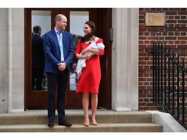 Britain's Prince William, Duke of Cambridge (L) and Britain's Catherine, Duchess of Cambridge show their newly-born son, their third child, to the media outside the Lindo Wing at St Mary's Hospital in central London, on April 23, 2018.