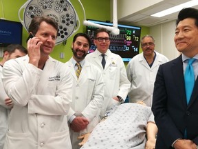This undated handout photo obtained April 23, 2018 courtesy of Johns Hopkins Medicine shows the medical team (L-R) Drs. Richard Redett,Trinity Bivalacqua, Brandacher Gerald, Arthur Bud Burnett and W.P. Andrew Lee(R), professor and director of plastic and reconstructive surgery at the Johns Hopkins University School of Medicine standing near a mannequin. Doctors at Johns Hopkins University said April 23, 2018 they have performed the world's first total penis and scrotum transplant on a US military serviceman who was wounded in Afghanistan.The 14-hour operation took place on March 26, and was performed by a team of nine plastic surgeons and two urology surgeons, JHU said in a statement."We are hopeful that this transplant will help restore near-normal urinary and sexual functions for this young man," said W.P. Andrew Lee, professor and director of plastic and reconstructive surgery at the Johns Hopkins University School of Medicine. The entire penis, scrotum without testicles and partial abdominal wall came from a deceased donor.