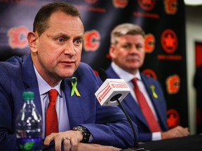 Calgary Flames GM Brad Treliving and the teams new head coach Bill Peters during a press conference in the Ed Whalen Media Lounge at the Scotiabank Saddledome in Calgary. Al Charest/Postmedia