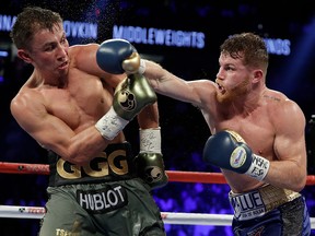 This Sept. 17, 2017 file photo shows Canelo Alvarez, right, fighting Gennady Golovkin in Las Vegas. (AP Photo/John Locher,File)